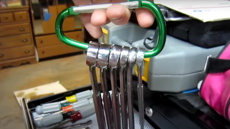 carabiner holding wrenches