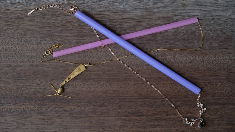 purple straws on gold necklaces