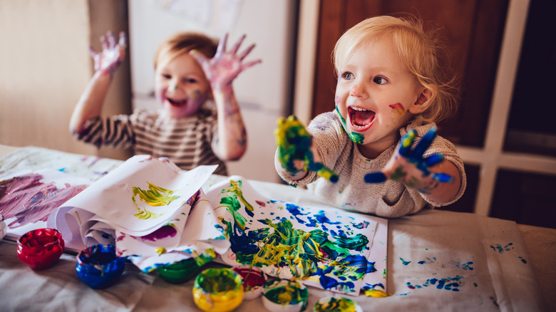 messy children fingerpainting