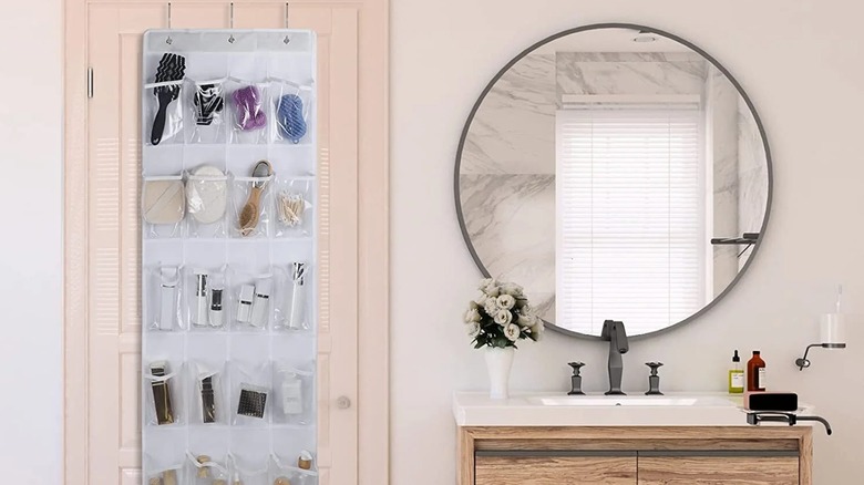 An over-the-door shoe organizer in a bathroom