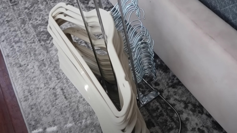 hangers over a paper towel holder