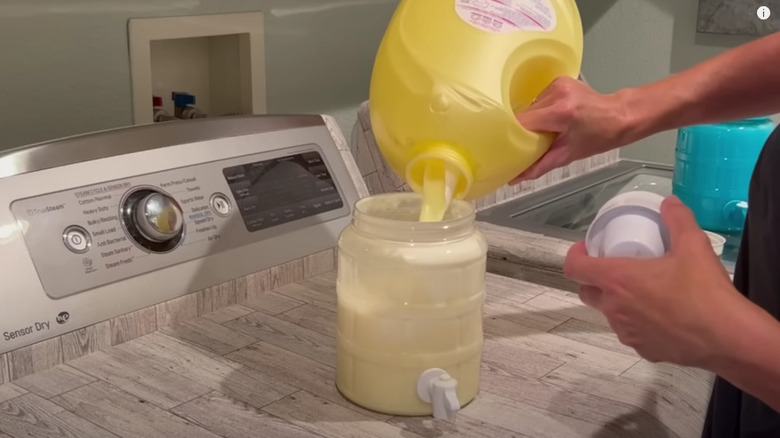 laundry detergent being poured into a drink dispenser