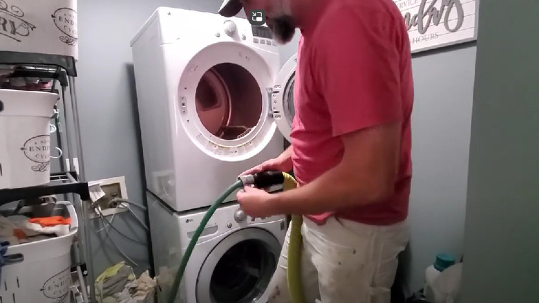 garden hose being taped to a ShopVac