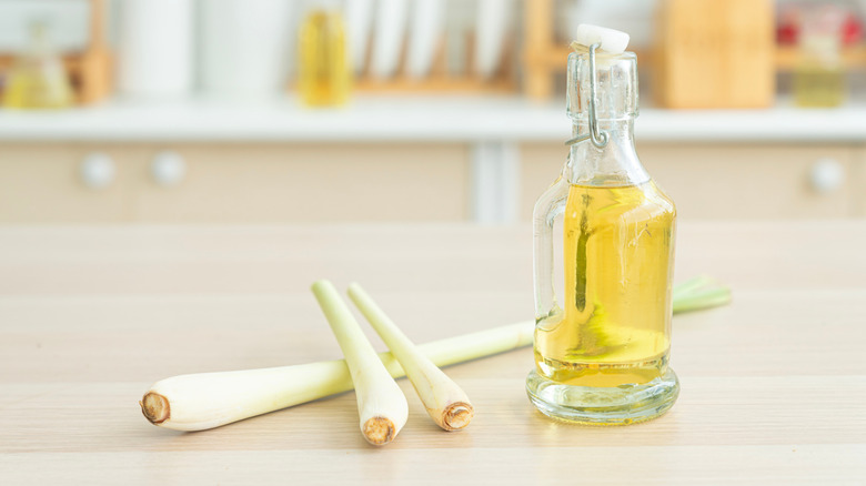 Lemongrass stalks and a bottle of oil