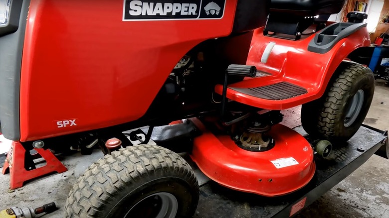 Snapper riding mower on a lift