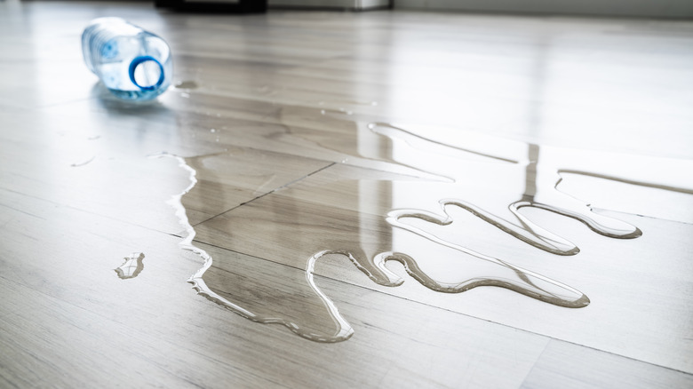 bottle of water spilled on floor