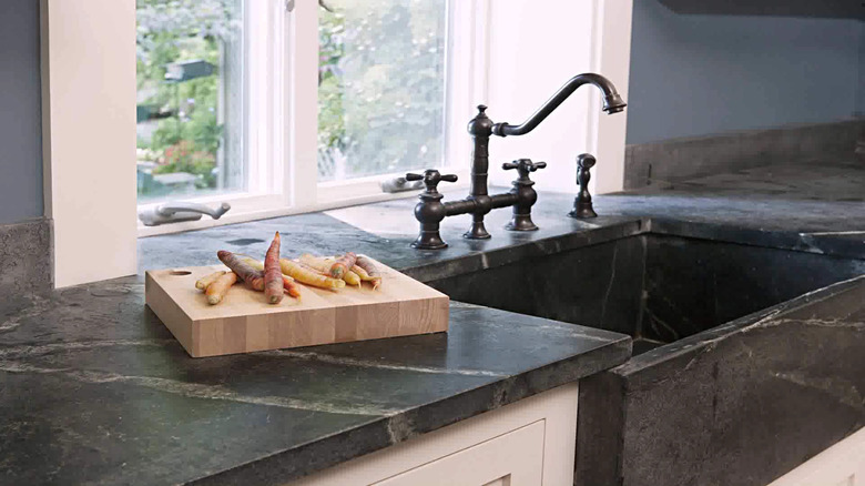 Black and gray veined soapstone countertop with sink