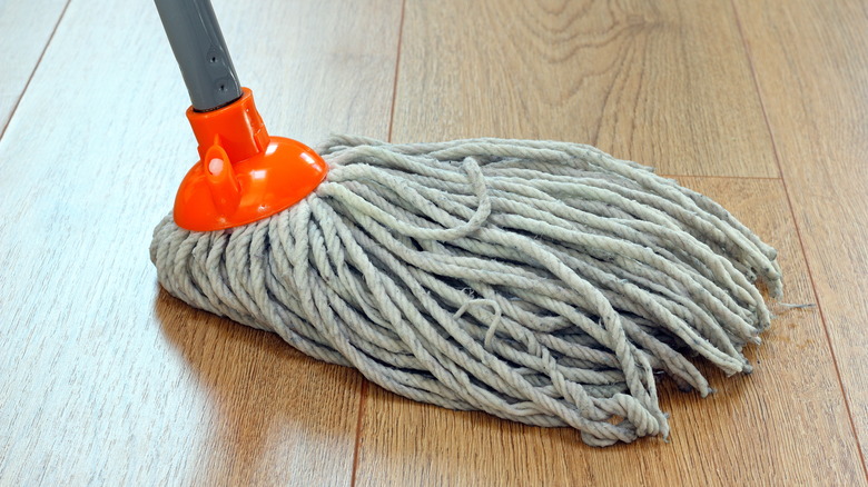 mop on brown vinyl floor