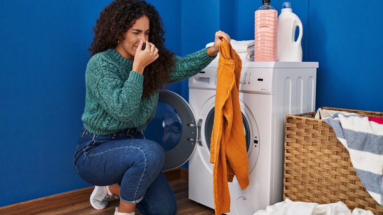 Woman with mildewy laundry 
