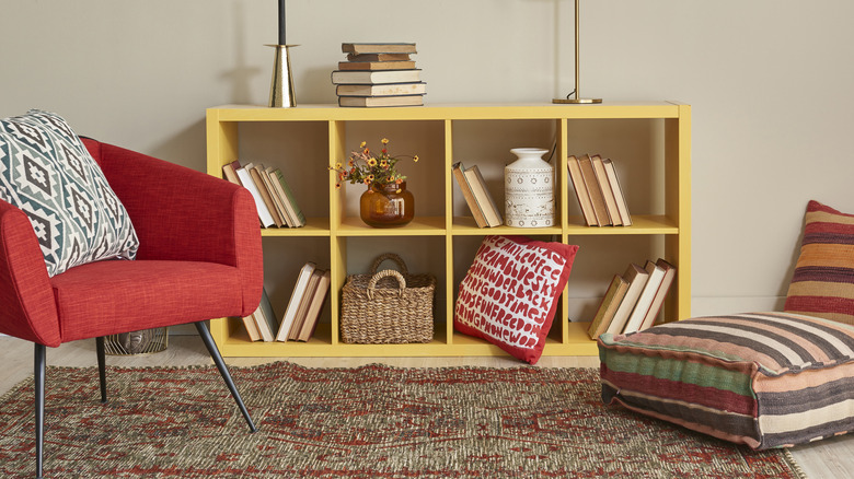 Yellow painted bookshelf in a living space