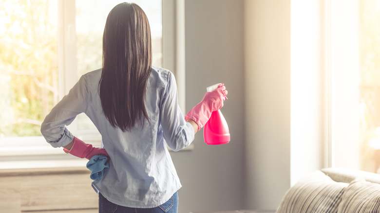 Person with spray bottle