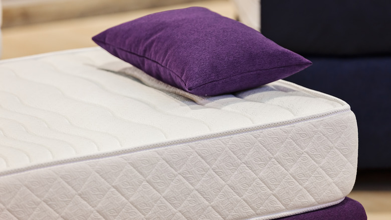 Mattress with purple pillow