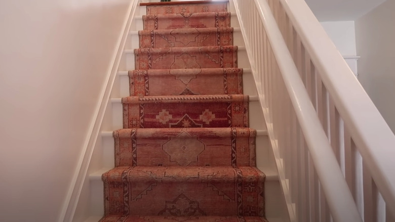 white stairs with runner