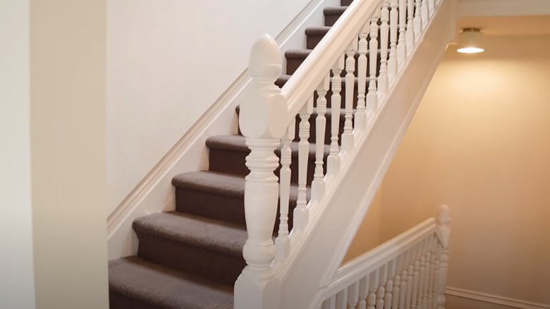 white railing with old carpet