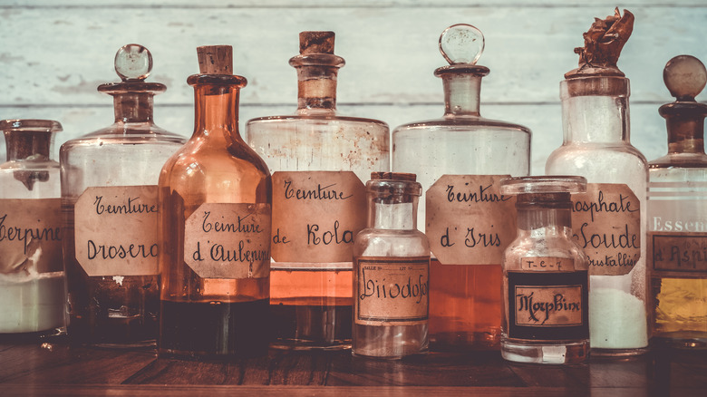 Vintage apothecary bottles on a table