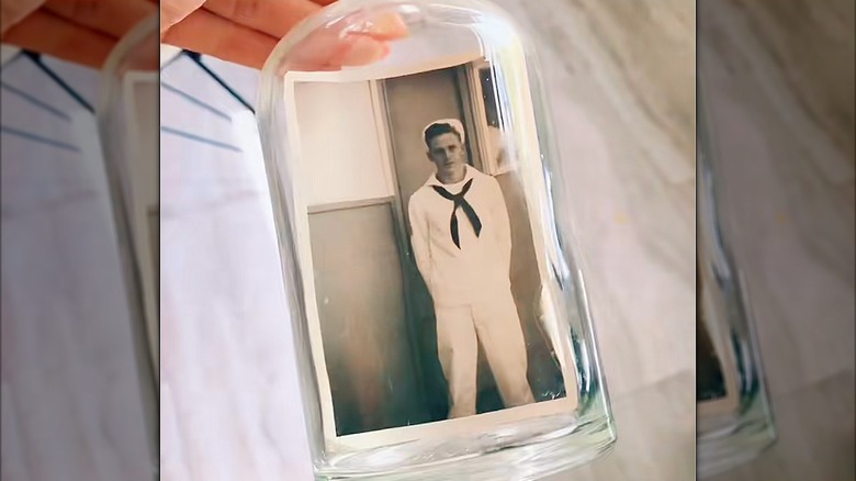 An old photo inside an apothecary jar