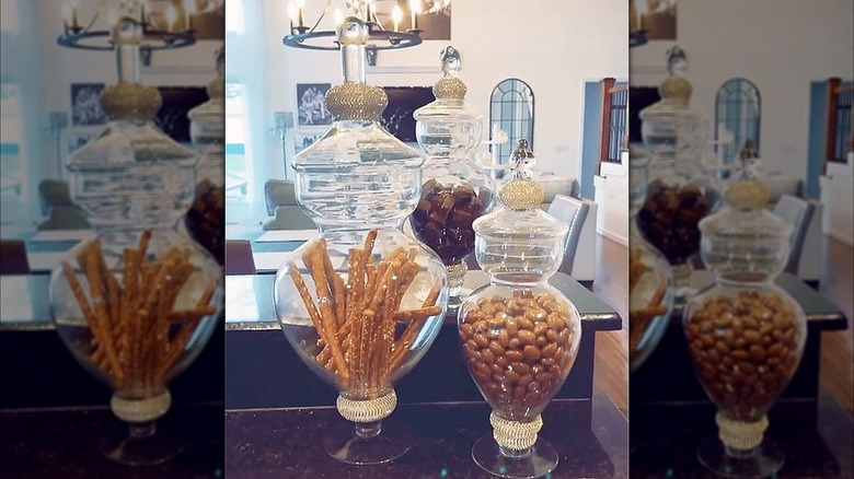 Apothecary jars with snack inside sitting on a counter