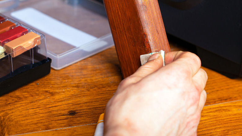 Repairing scratched wooden furniture 