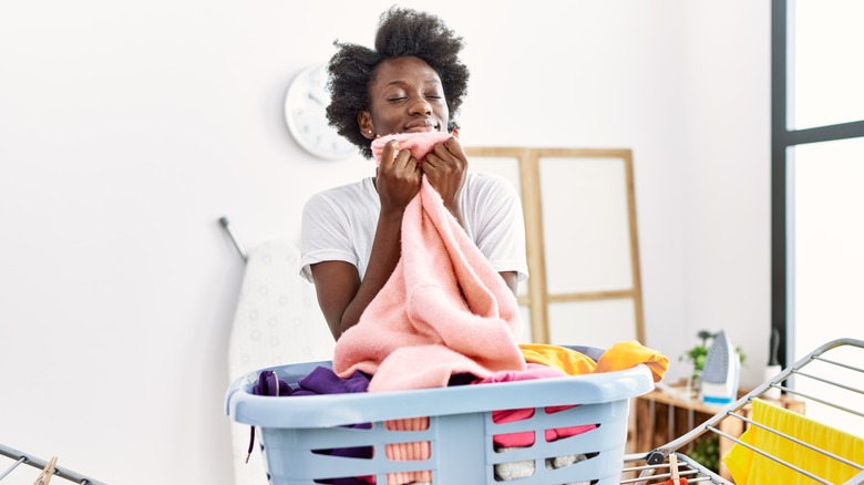 Woman holding fresh laundry