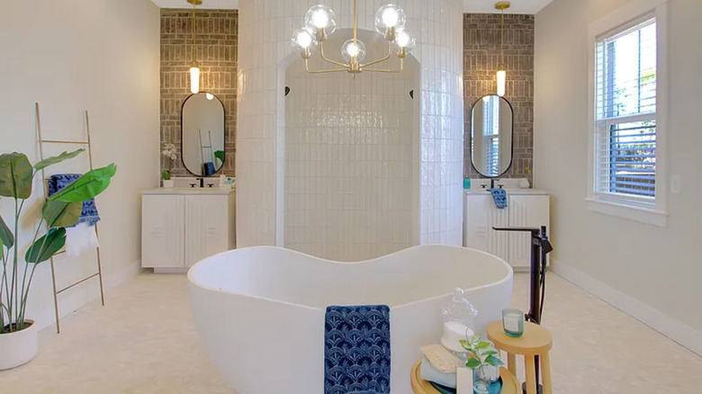 bathroom with shower and tub