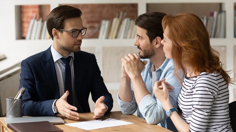 Man advising couple