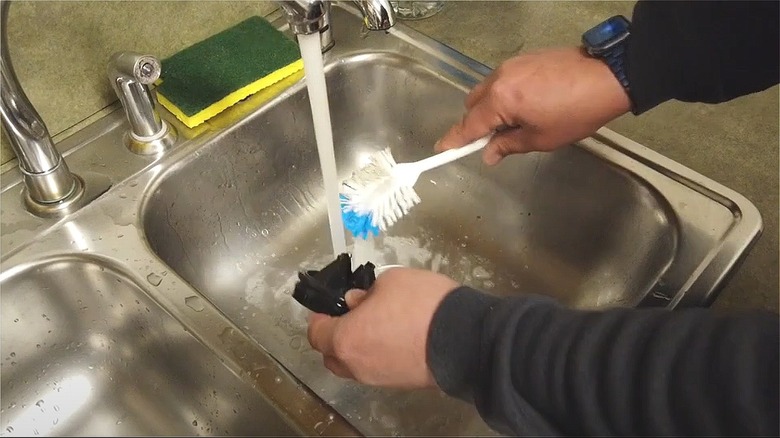 Man washing splash guard