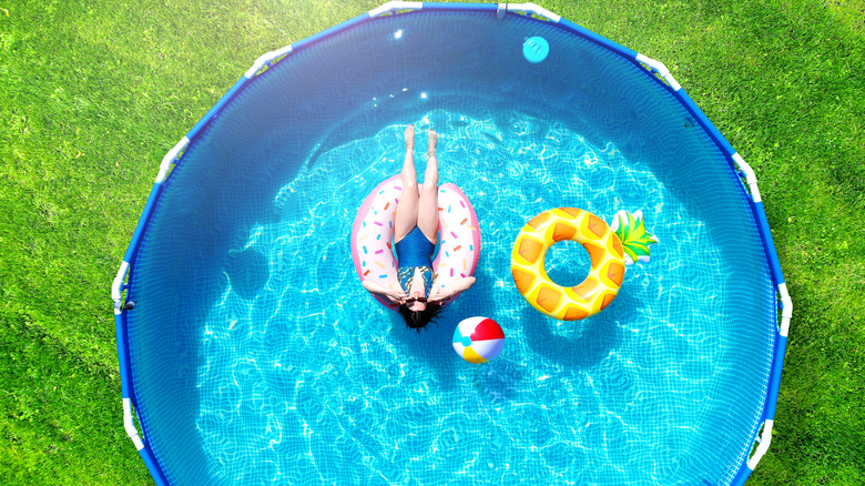 woman floating in pool