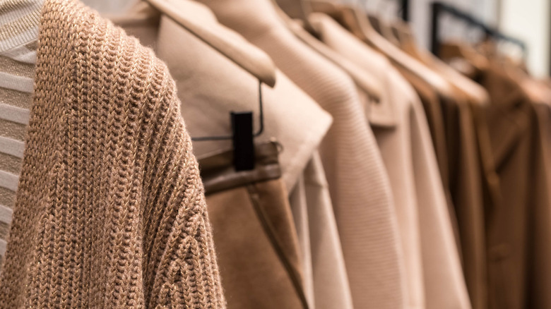 sweaters and coats on hangers