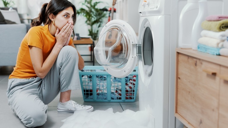 woman shocked by laundry machine