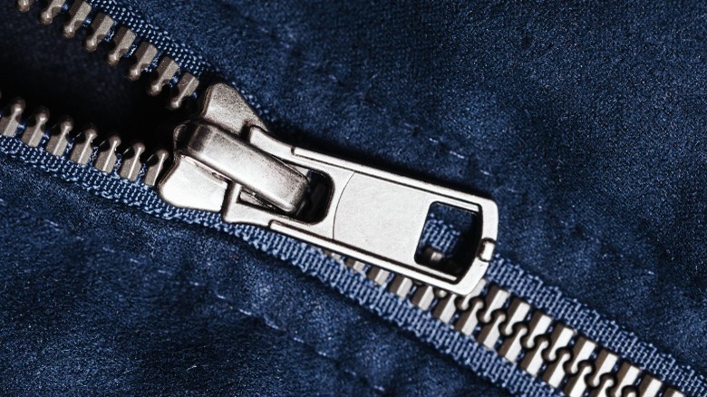 closeup of zipper, blue fabric