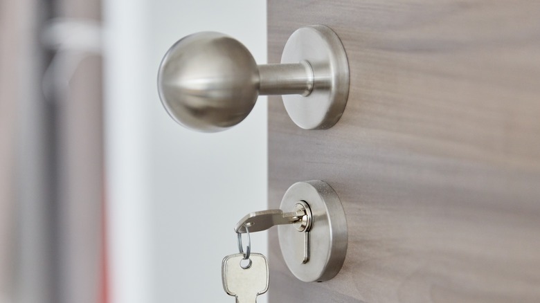Shiny silver doorknob with keys