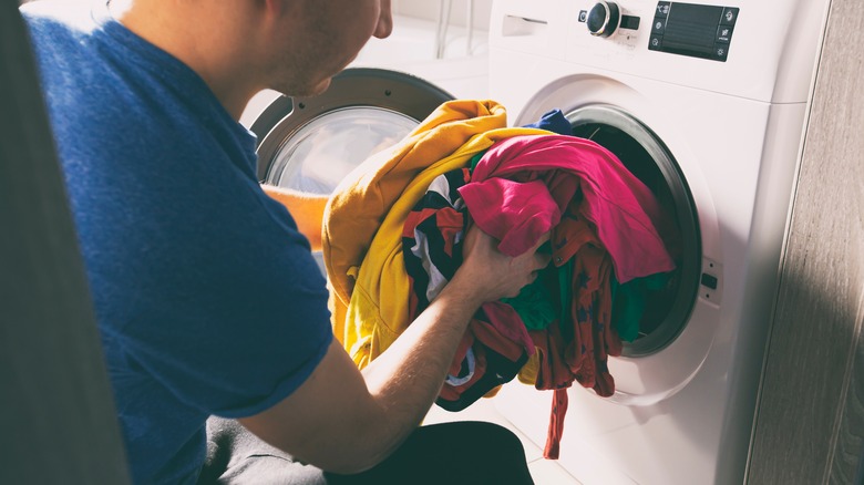 Person loading dryer