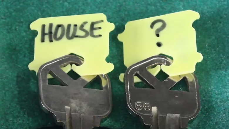 Yellow plastic bread tags on keys to label which key is which