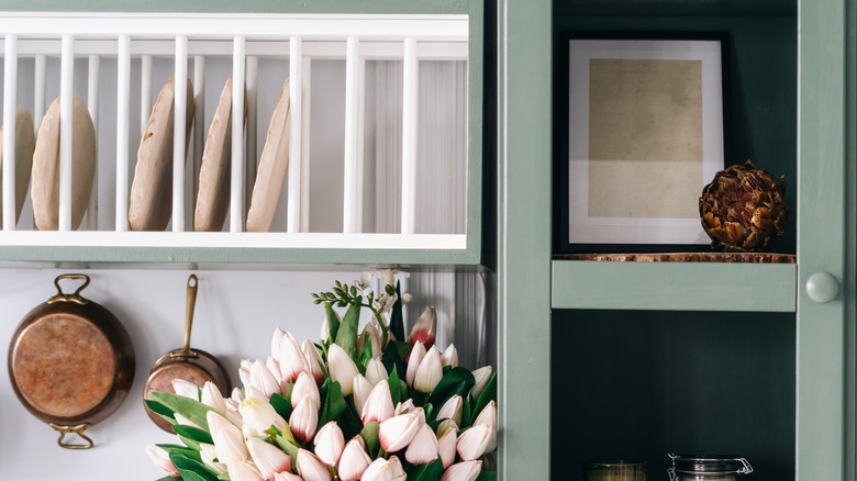 Kitchen with a white plate rack hanging on the wall