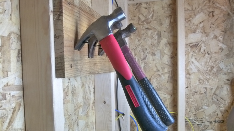 Hammers hung using drywall screws