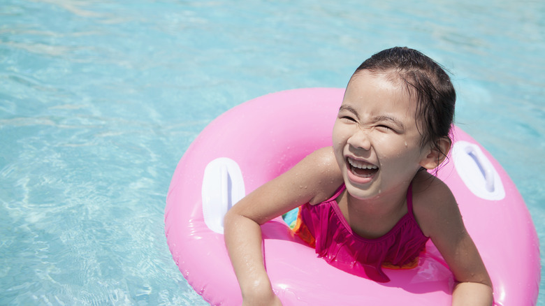 Happy child in a pool