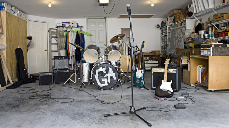 Musical instruments set up inside a garage.