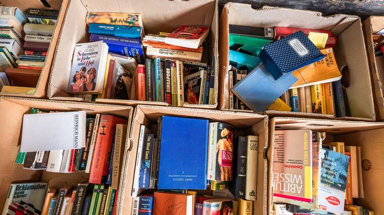 Books packed into cardboard boxes and stored in the garage.