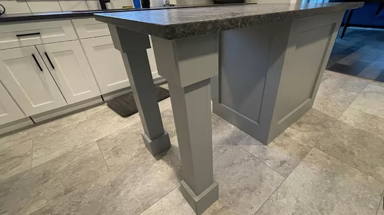 An island countertop has DIY support posts