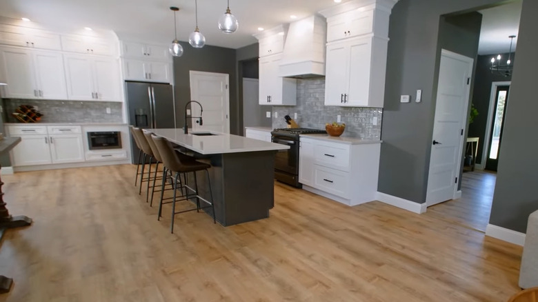 Large white kitchen with island