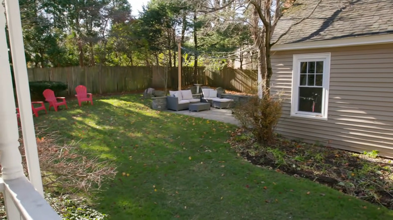 Fenced-in backyard with patio