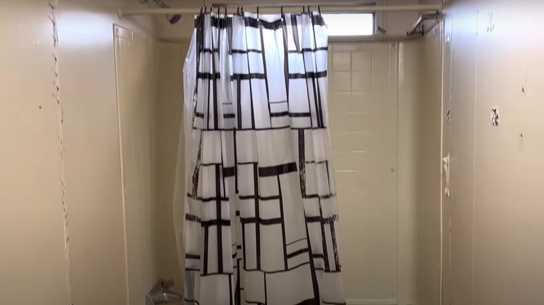 yellow tiles and shower curtain