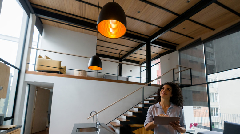 Woman controls kitchen lights through app