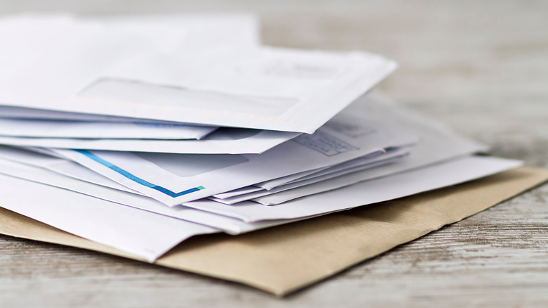 pile of mail on desk