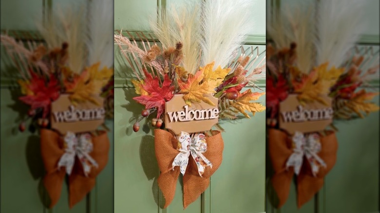 rake autumn wreath on door 