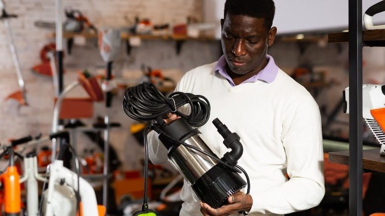 Man looking at a pump in a store