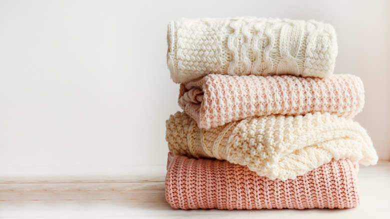 stack of knit sweaters