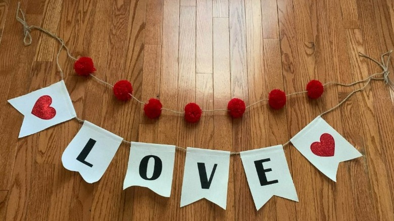 Paper banner spelling 'LOVE'