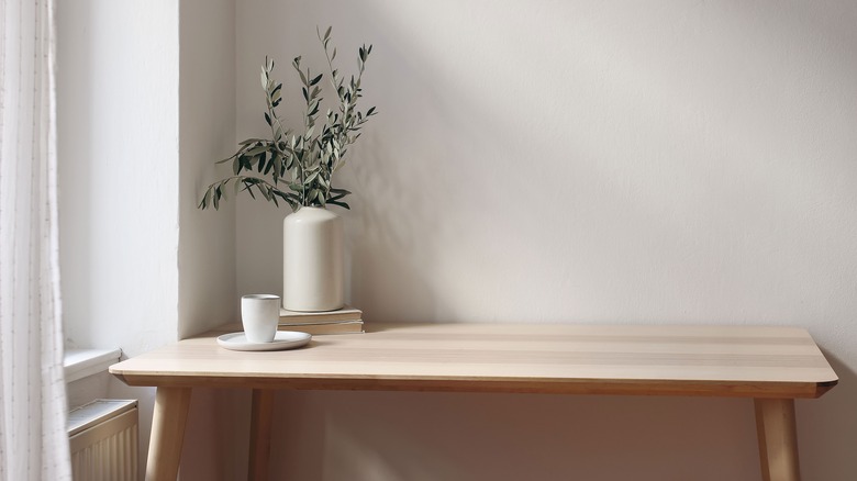 Olive branches in white vase