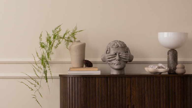 Branch in vase on sidetable